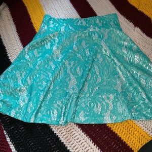 Teal laced mini skirt